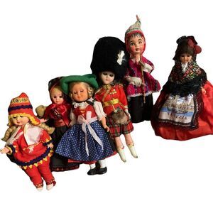 Set of 6 ethnic dolls. Measures 9 inches to 8 inches.